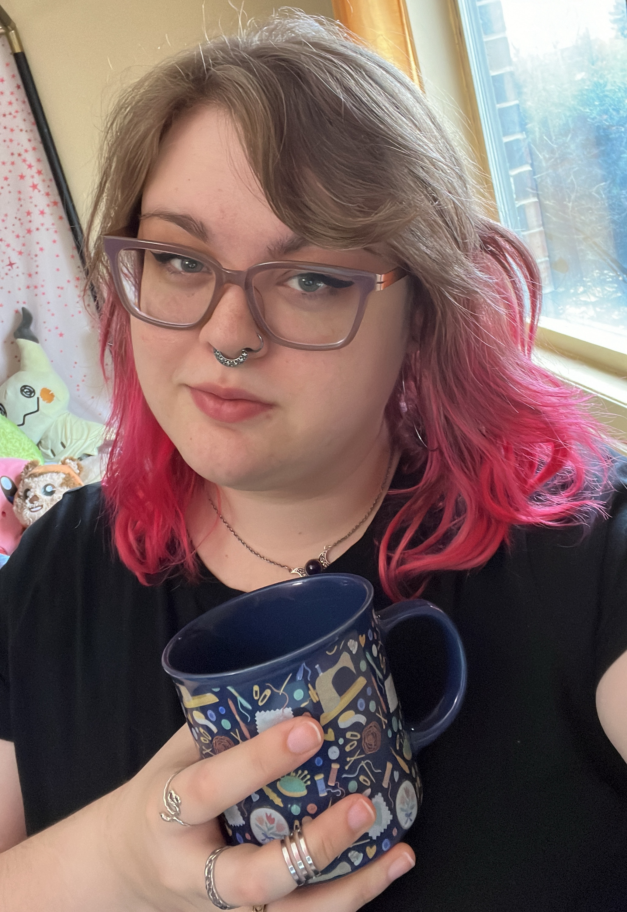 Picture of the business owner Pepper holding a mug
